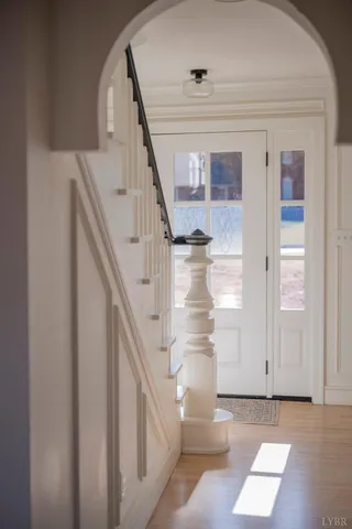 a kitchen with kitchen island a stove a sink and a refrigerator with wooden floor
