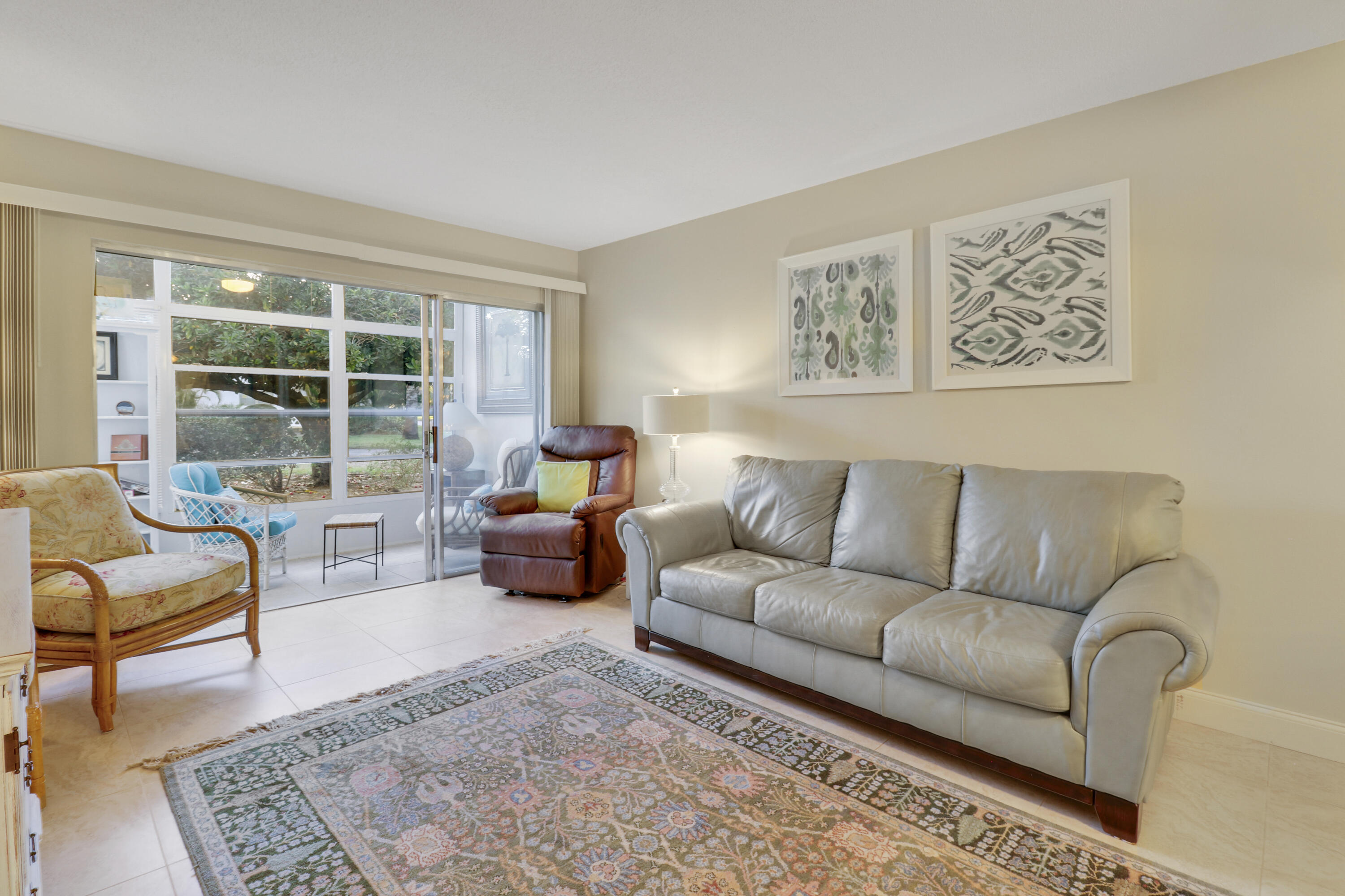 2929 Southeast Ocean Boulevard, Unit 1122 Stuart, FL 34996 - Photo 15 of 37 a living room with furniture and a large window