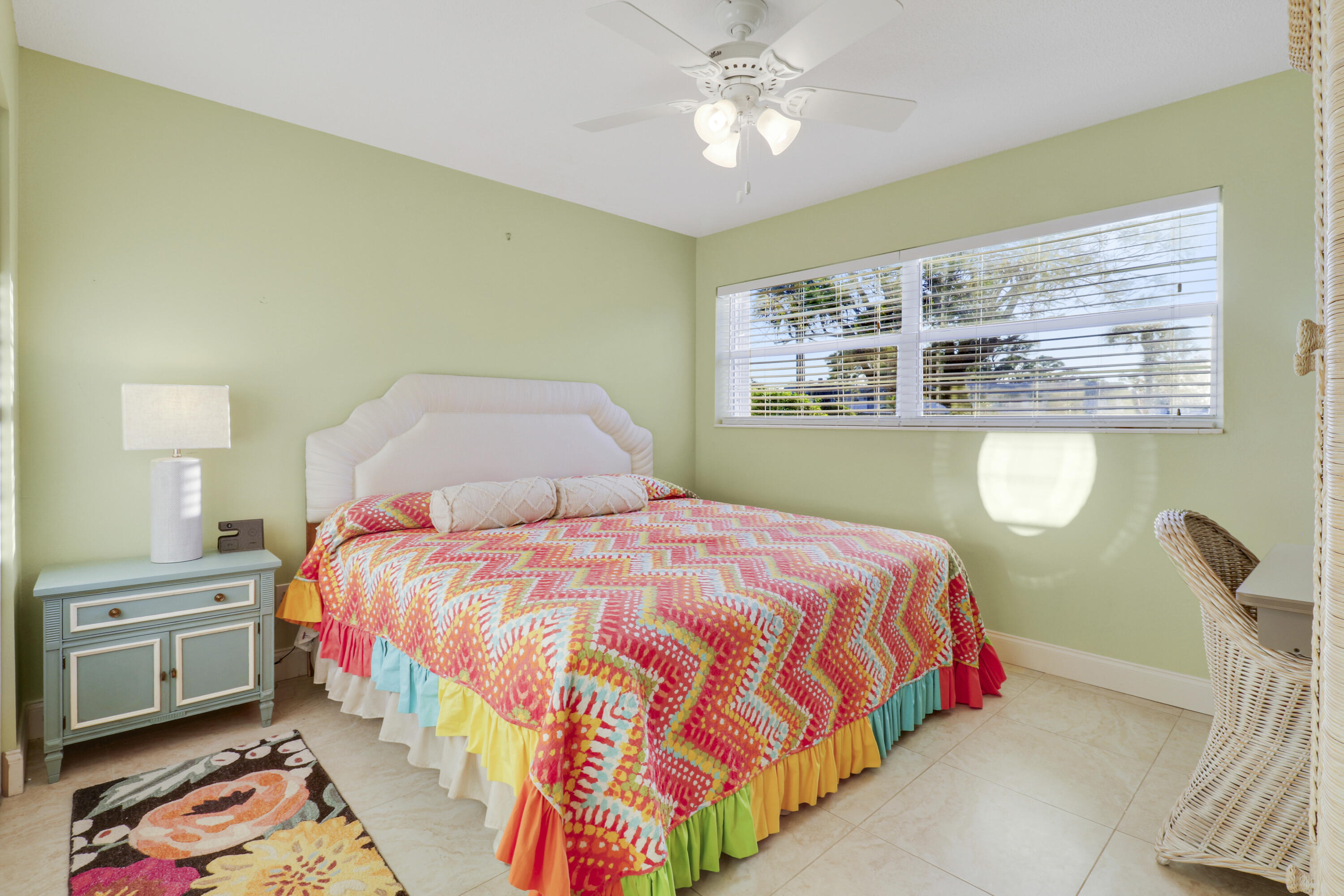 2929 Southeast Ocean Boulevard, Unit 1122 Stuart, FL 34996 - Photo 18 of 37 a bedroom with a bed and dresser