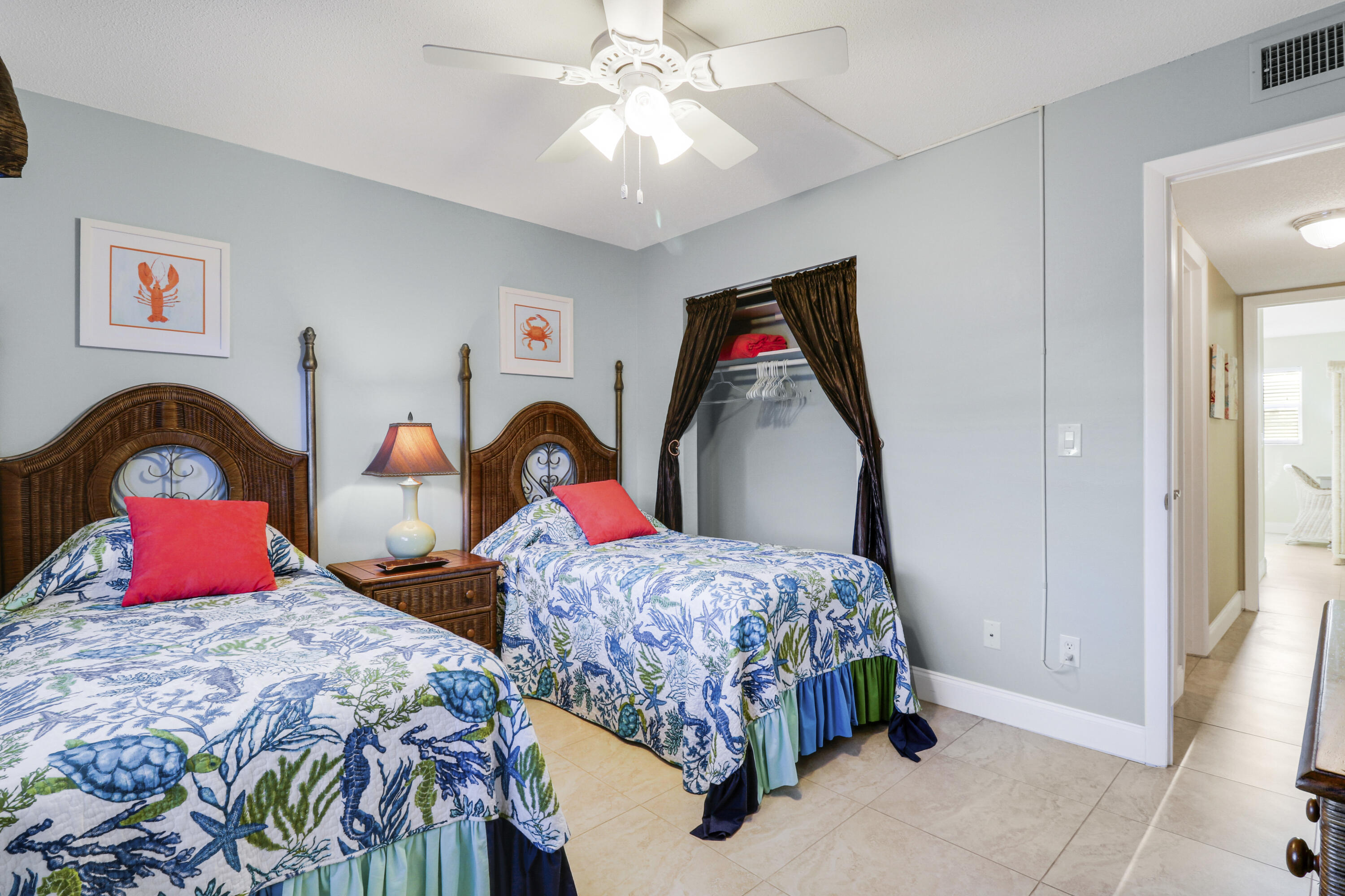 2929 Southeast Ocean Boulevard, Unit 1122 Stuart, FL 34996 - Photo 22 of 37 a bedroom with two bed and a window