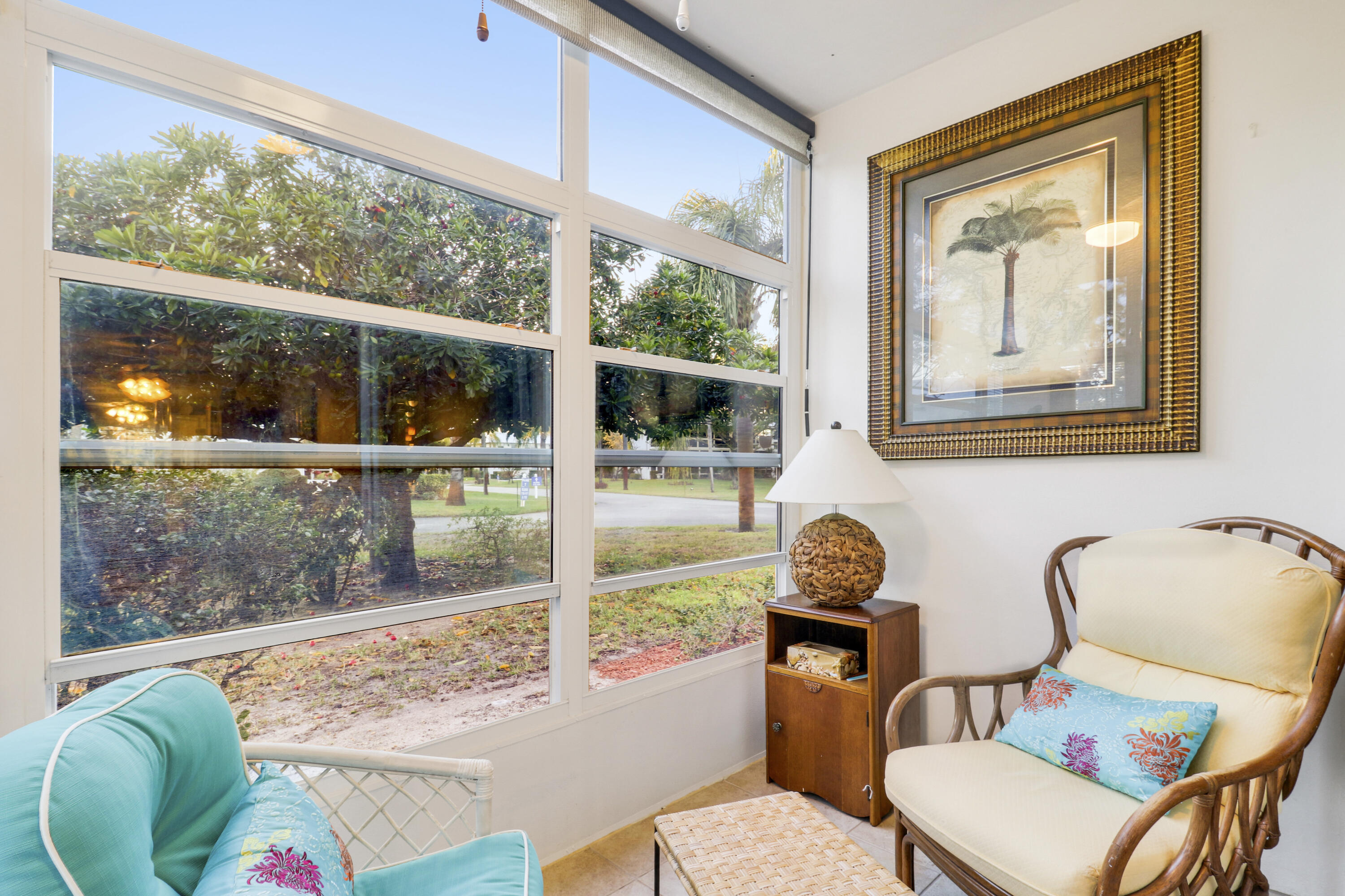 2929 Southeast Ocean Boulevard, Unit 1122 Stuart, FL 34996 - Photo 25 of 37 a room with two chairs and a large window