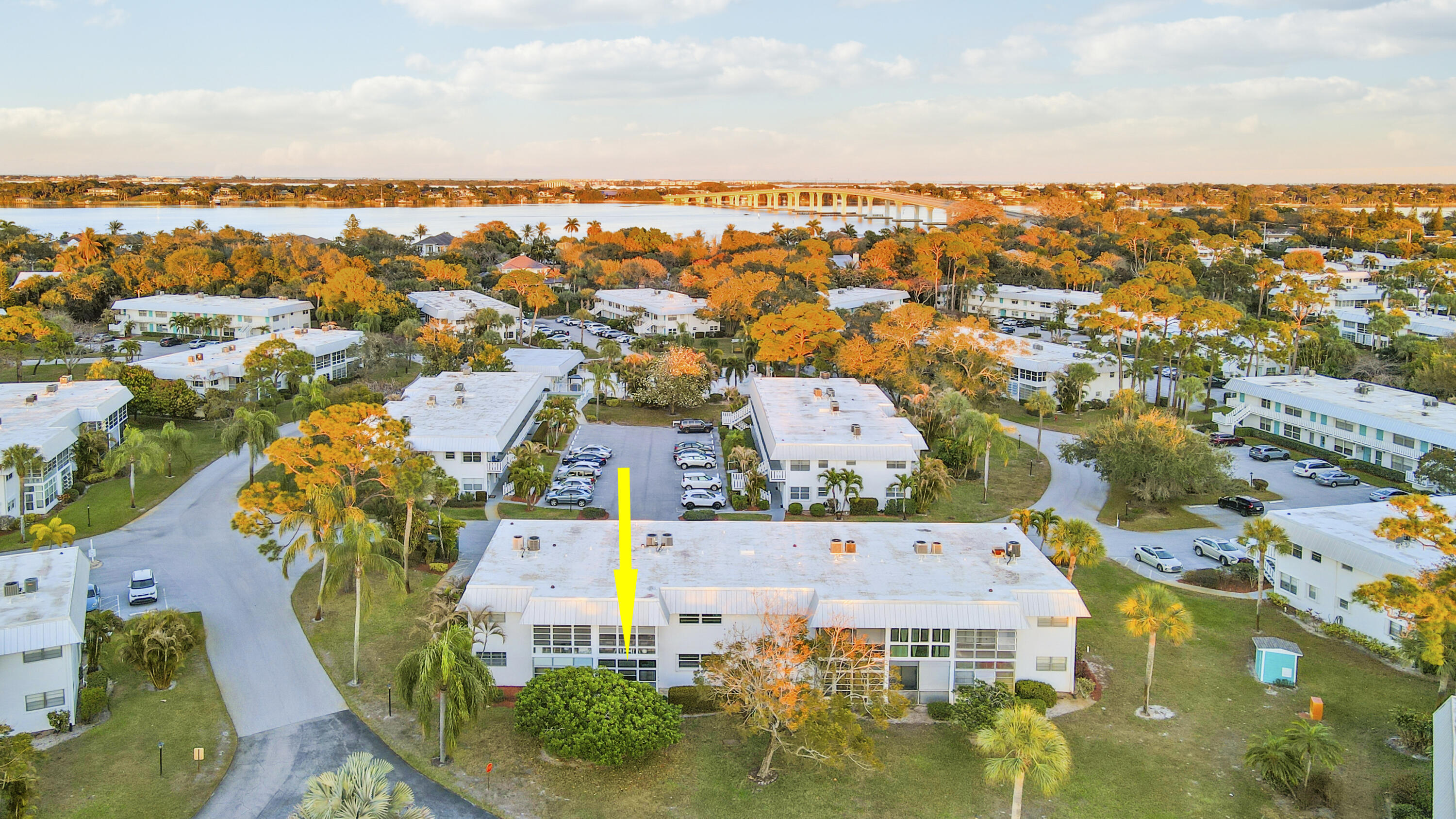 2929 Southeast Ocean Boulevard, Unit 1122 Stuart, FL 34996 - Photo 28 of 37 an aerial view of residential houses with outdoor space