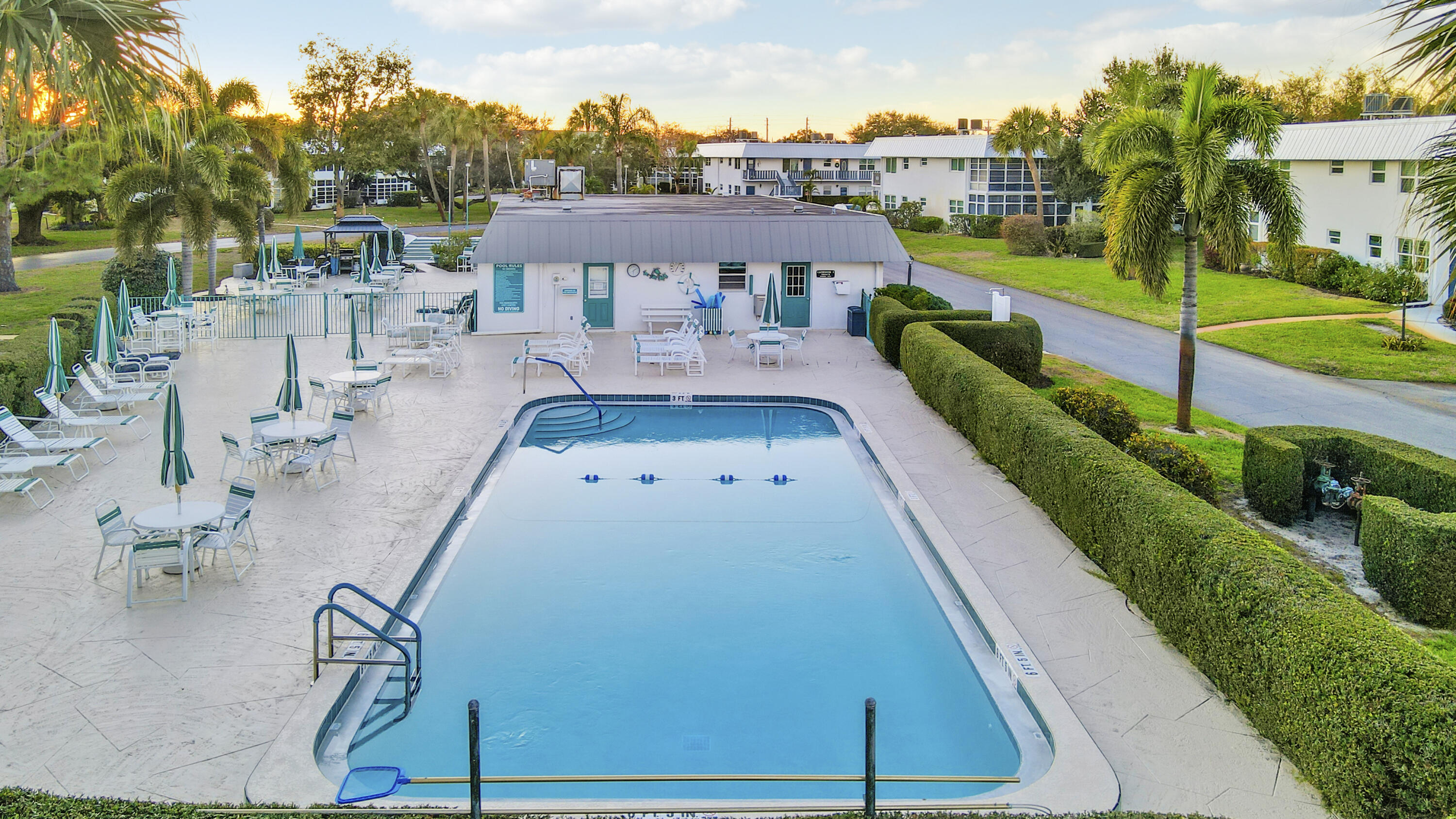 2929 Southeast Ocean Boulevard, Unit 1122 Stuart, FL 34996 - Photo 29 of 37 an aerial view of a house with swimming pool garden and trees