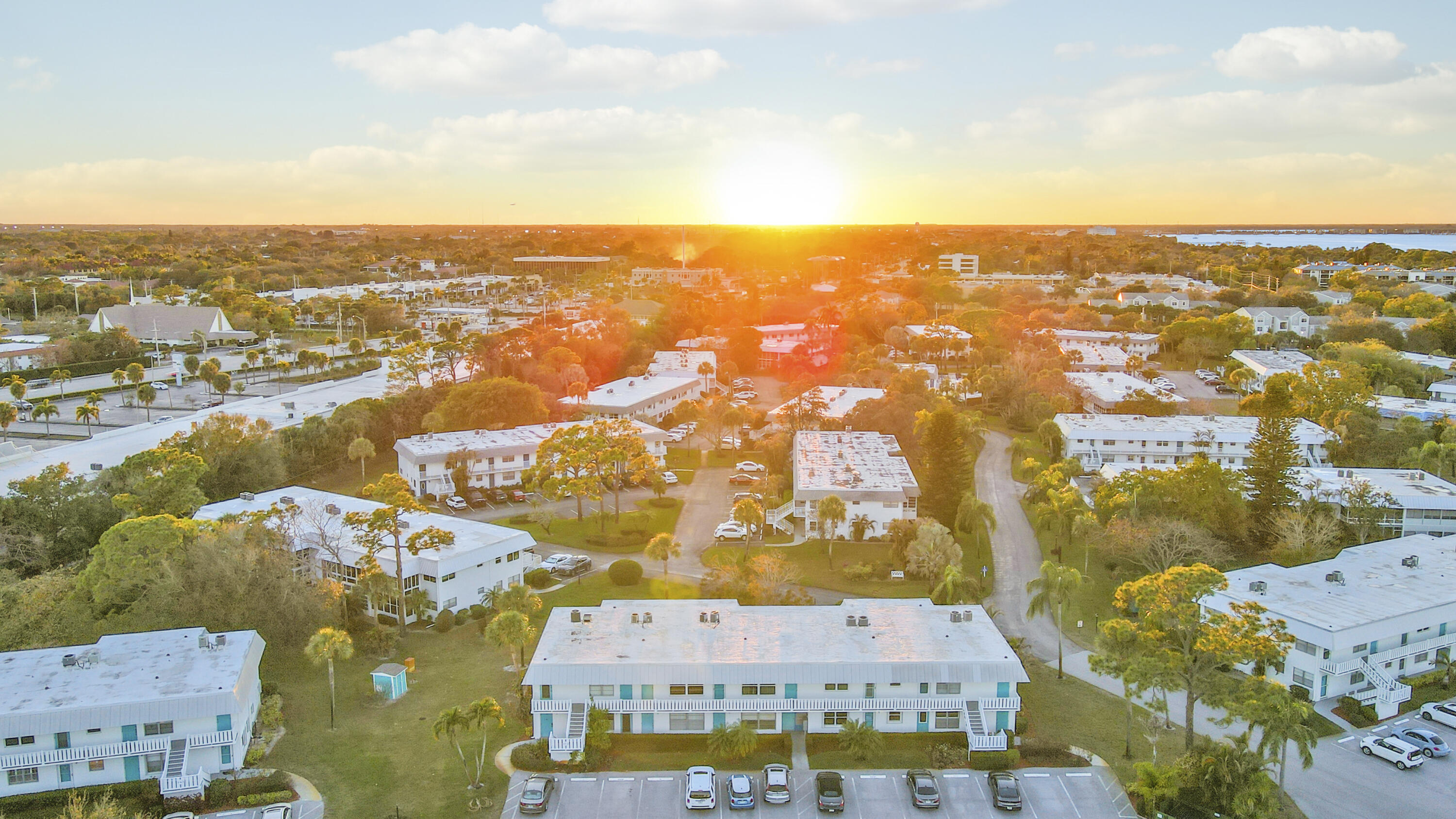 2929 Southeast Ocean Boulevard, Unit 1122 Stuart, FL 34996 - Photo 30 of 37 an aerial view of residential building with parking space