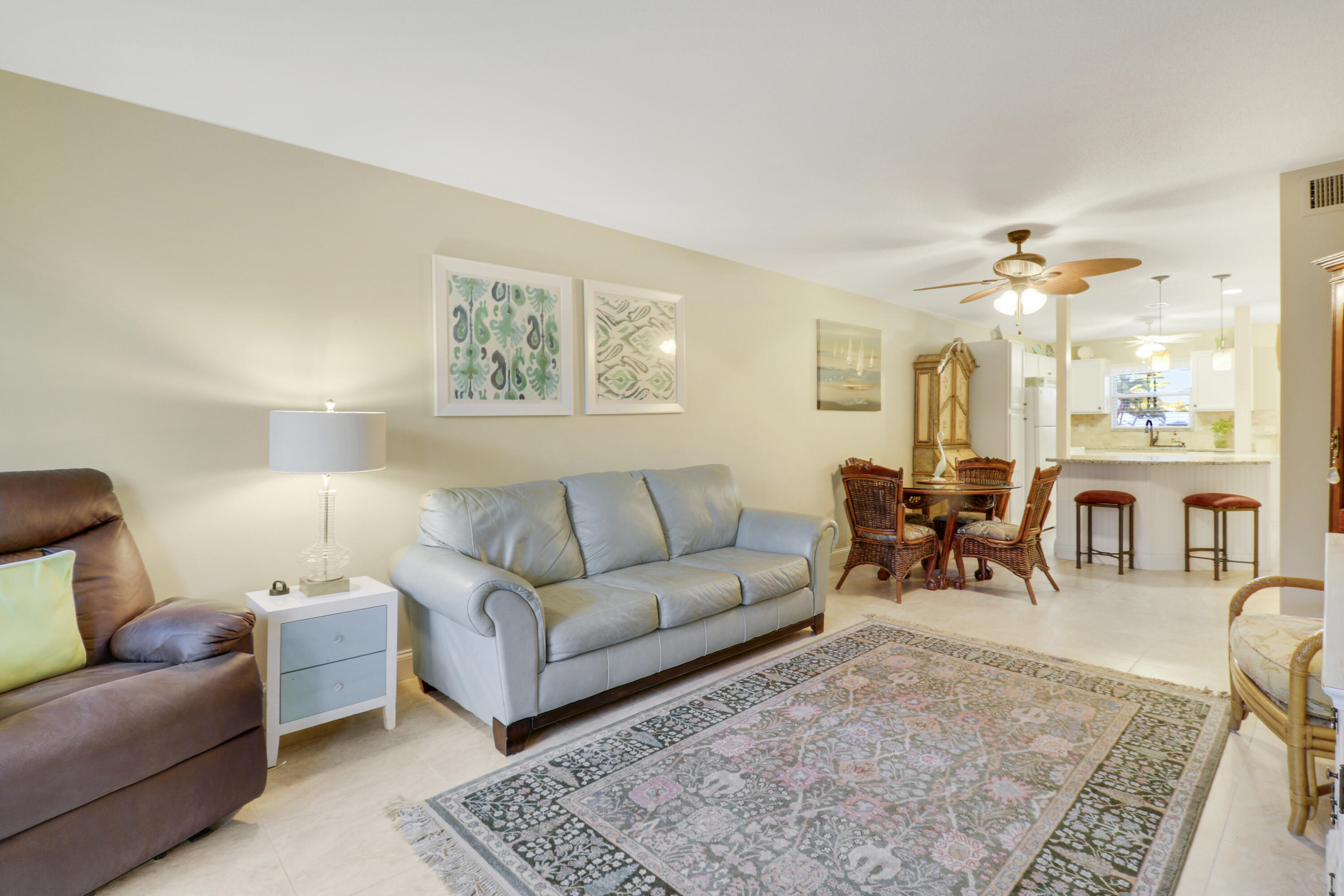 2929 Southeast Ocean Boulevard, Unit 1122 Stuart, FL 34996 - Photo 5 of 37 a living room with furniture and a large window