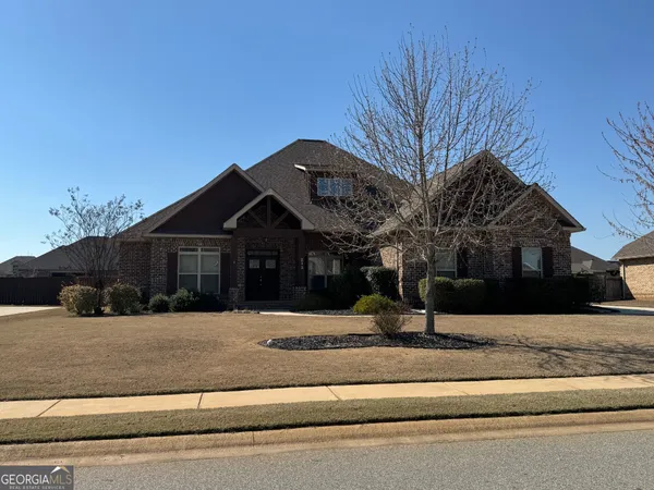 a front view of a house with a yard
