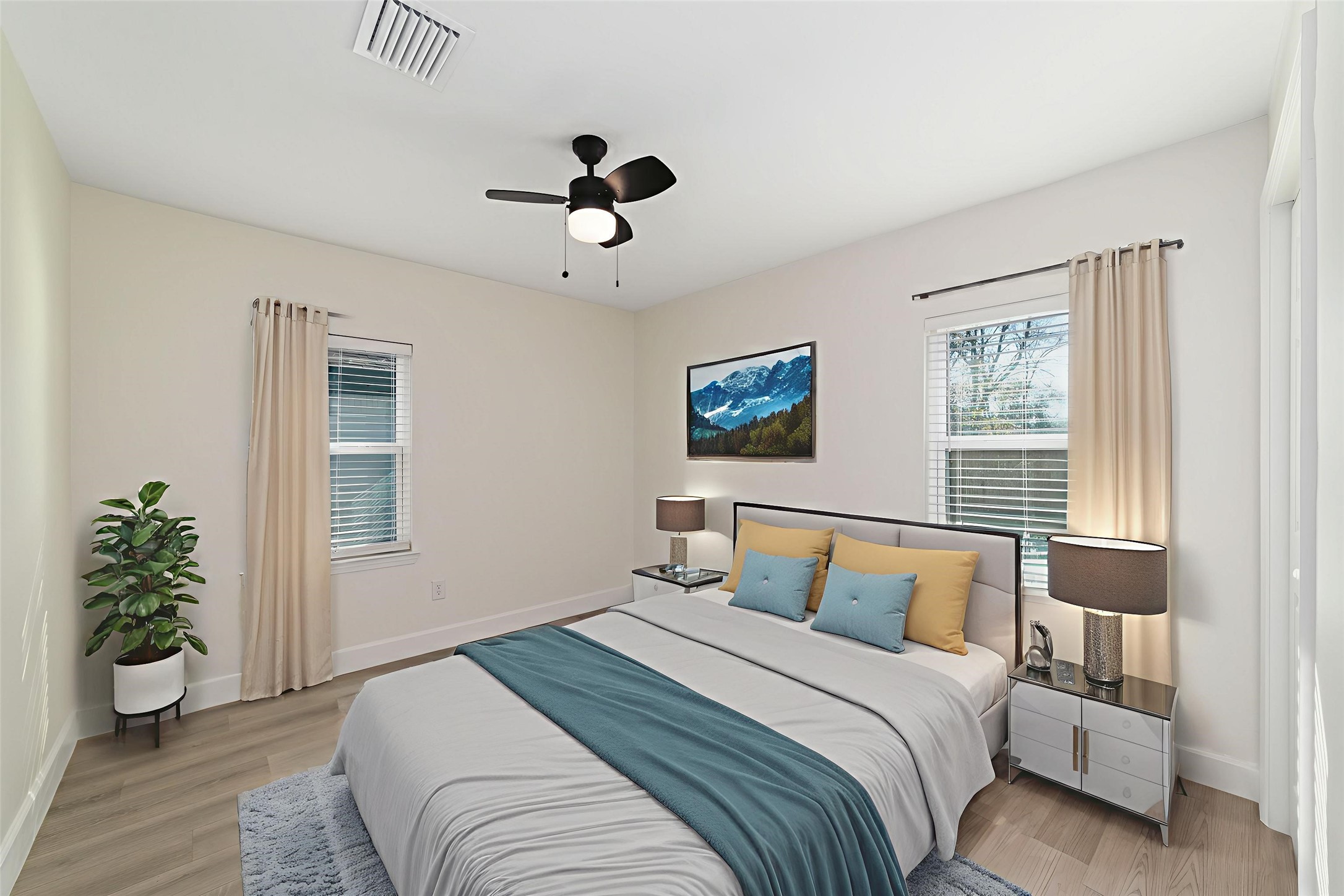 714 East 43rd Street Houston, TX 77022 - Photo 12 of 20 a bedroom with a large bed and a window