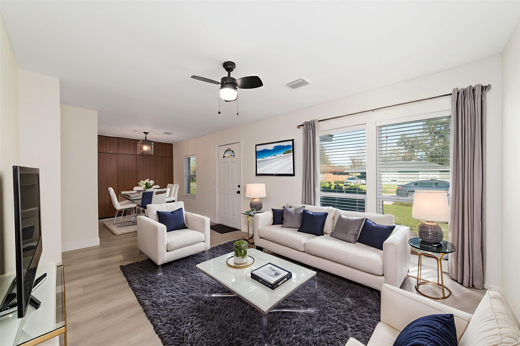 714 East 43rd Street Houston, TX 77022 - Photo 2 of 20 a living room with furniture and a flat screen tv
