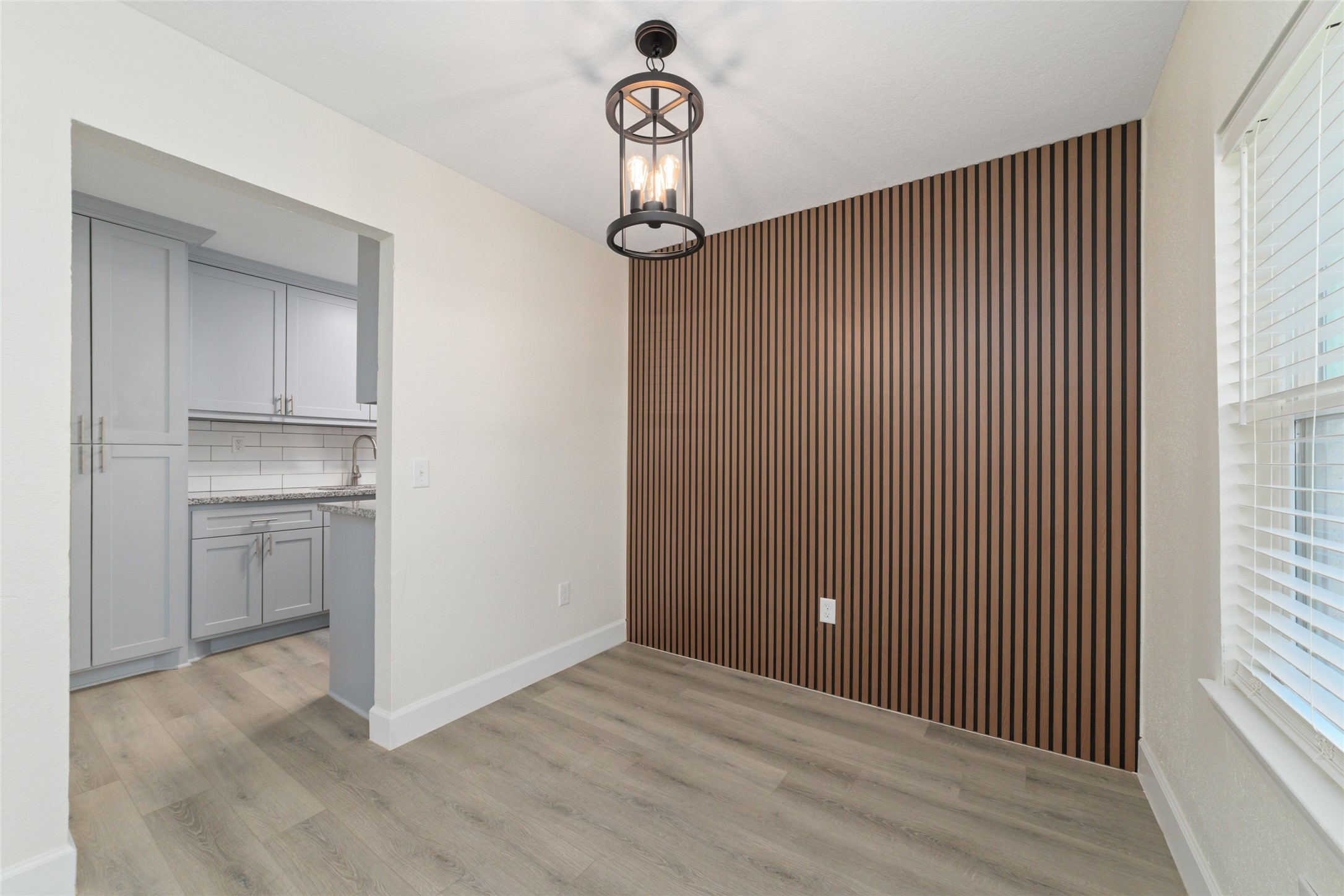 714 East 43rd Street Houston, TX 77022 - Photo 4 of 20 a view of a livingroom with wooden floor