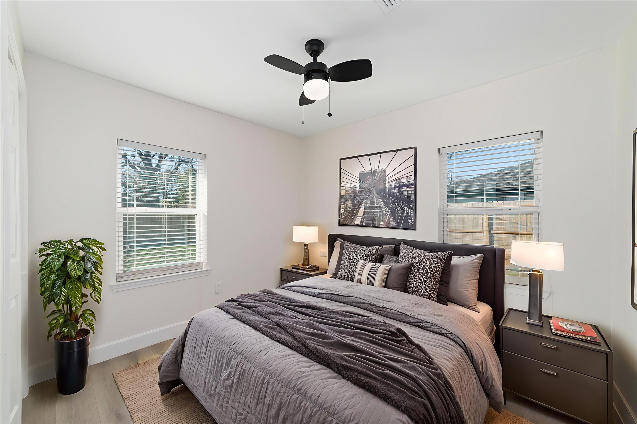 714 East 43rd Street Houston, TX 77022 - Photo 10 of 20 a bedroom with a bed and a large window