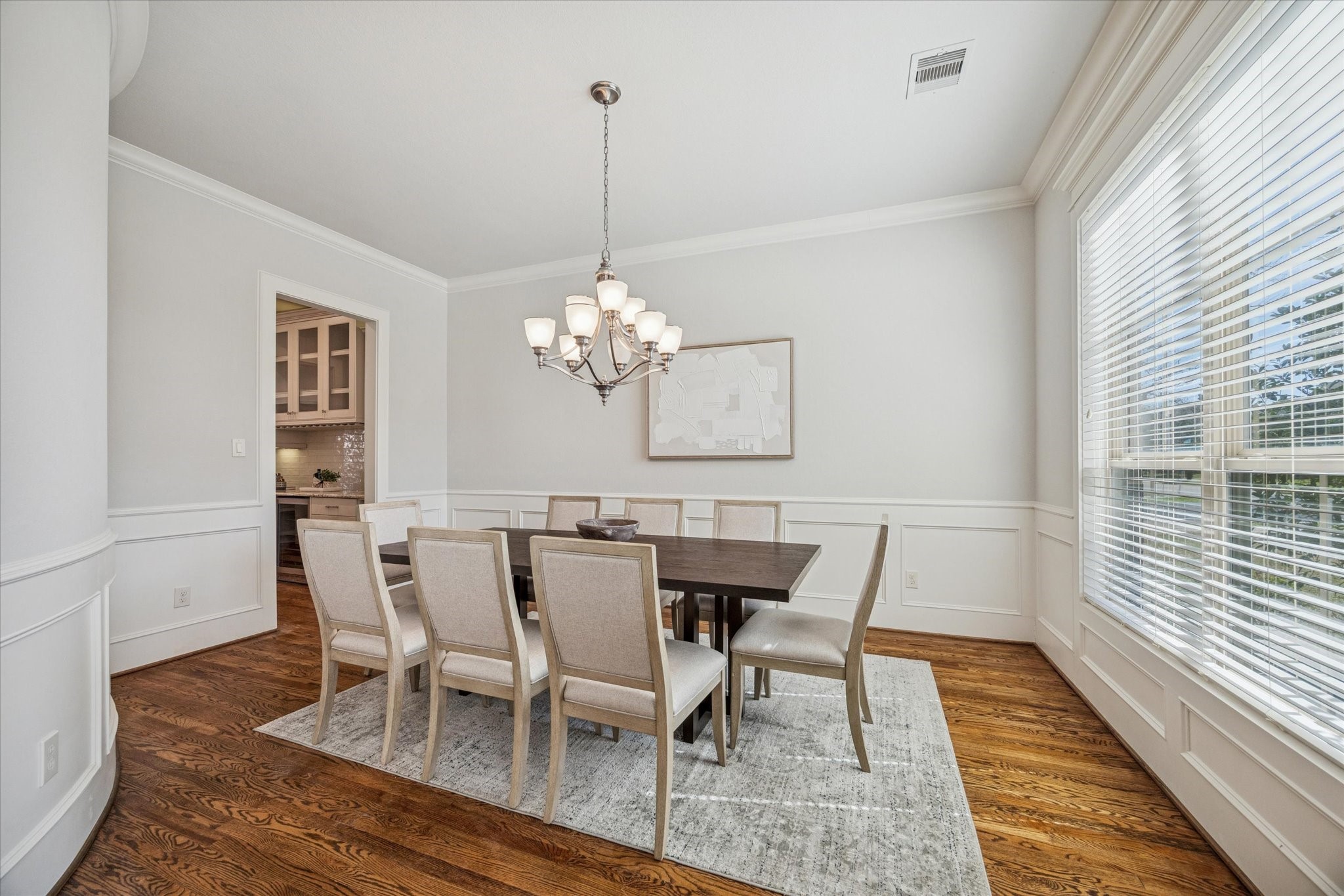 1802 Wakefield Drive Houston, TX 77018 - Photo 10 of 47 Just off the foyer, you’ll find a stunning formal dining room featuring hardwood floors and a neutral color palette, The perfect setting for both everyday meals and special gatherings.