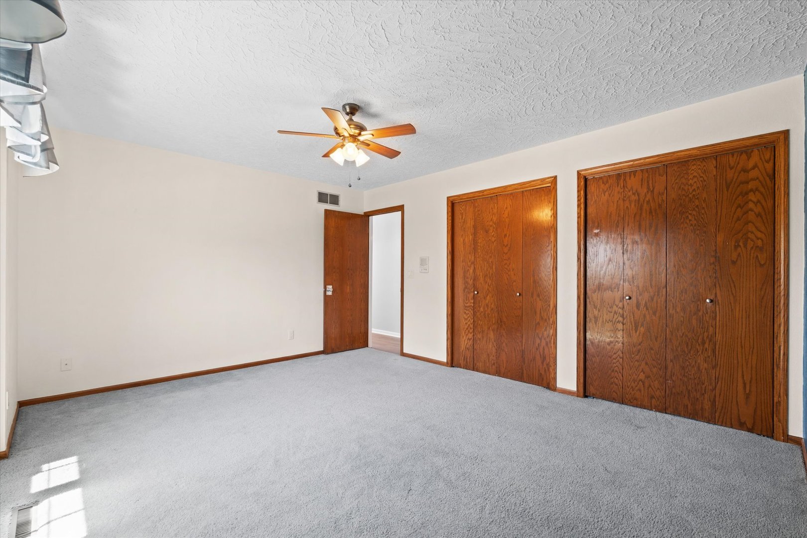 10 Oak Grove Road Geneseo, IL 61254 - Photo 21 of 43 a view of an empty room with a window