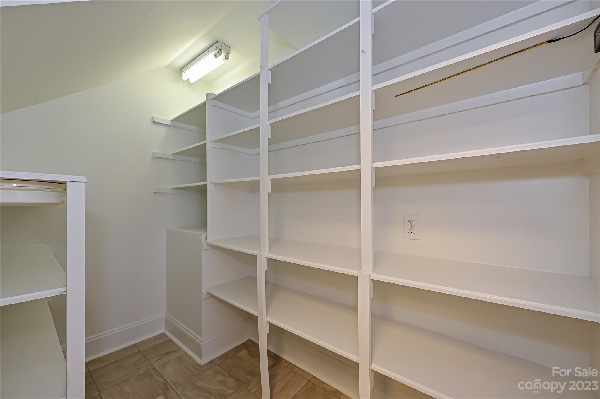 8834 Wingard Road Waxhaw, NC 28173 - Photo 12 of 46 a view of walk in closet with empty racks