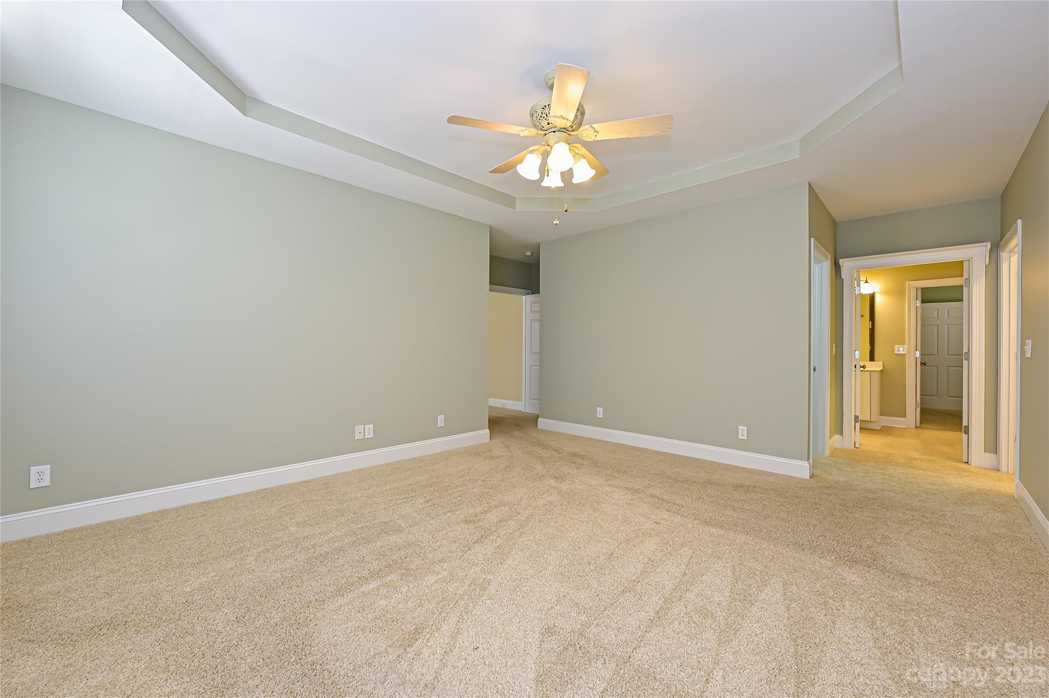 8834 Wingard Road Waxhaw, NC 28173 - Photo 23 of 46 a view of an empty room with a chandelier fan