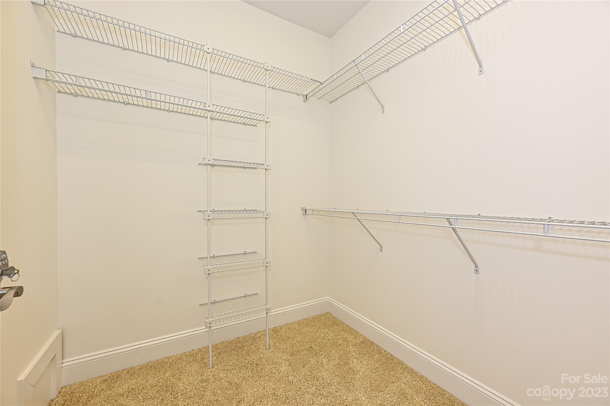 8834 Wingard Road Waxhaw, NC 28173 - Photo 29 of 46 a view of walk in closet with empty racks