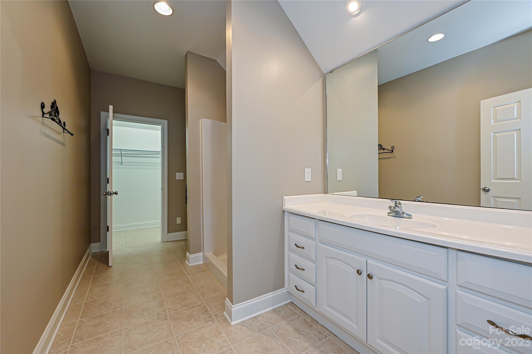 8834 Wingard Road Waxhaw, NC 28173 - Photo 38 of 46 a bathroom with a sink and a mirror