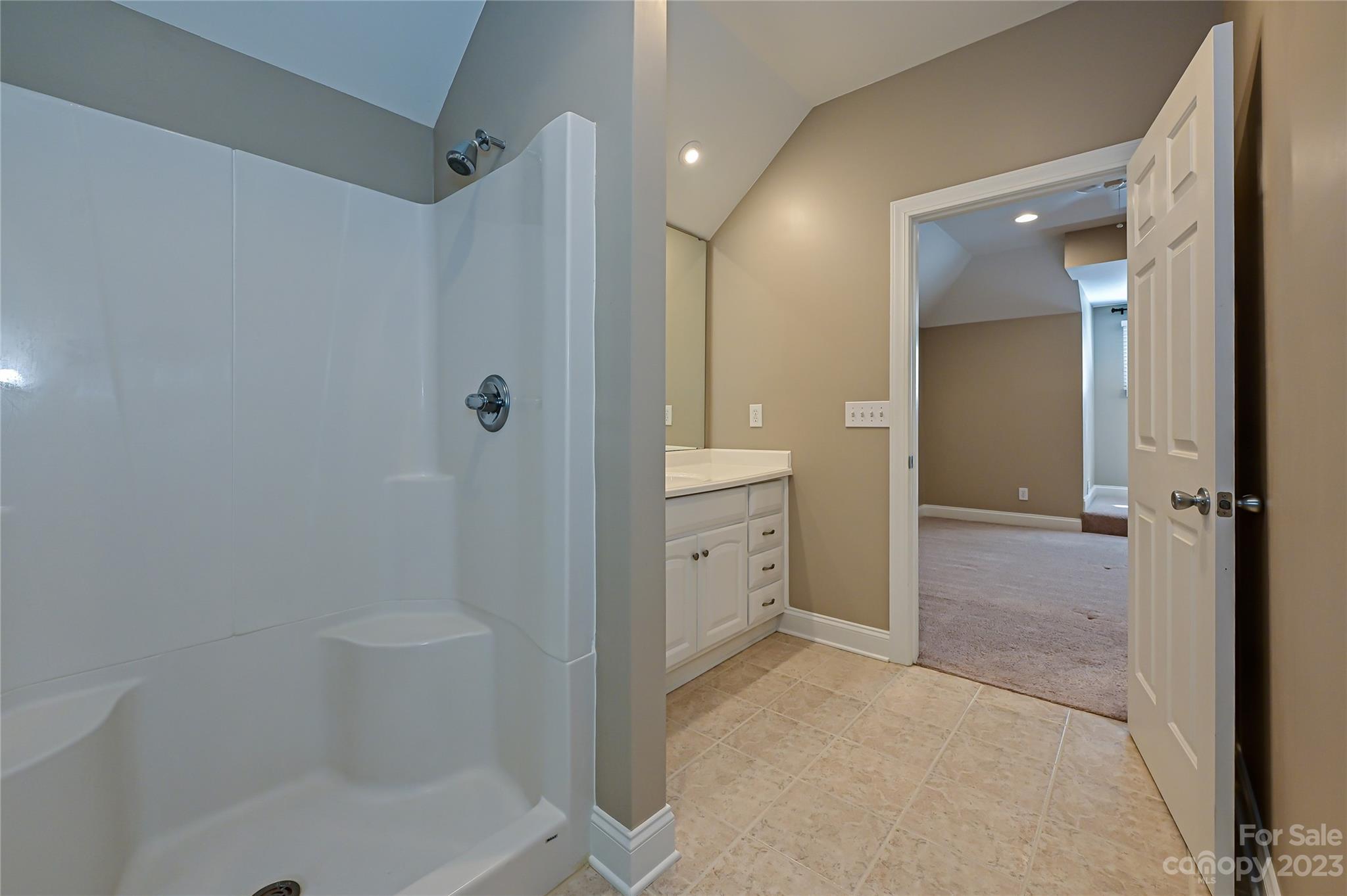 8834 Wingard Road Waxhaw, NC 28173 - Photo 39 of 46 a bathroom with a shower and a tub