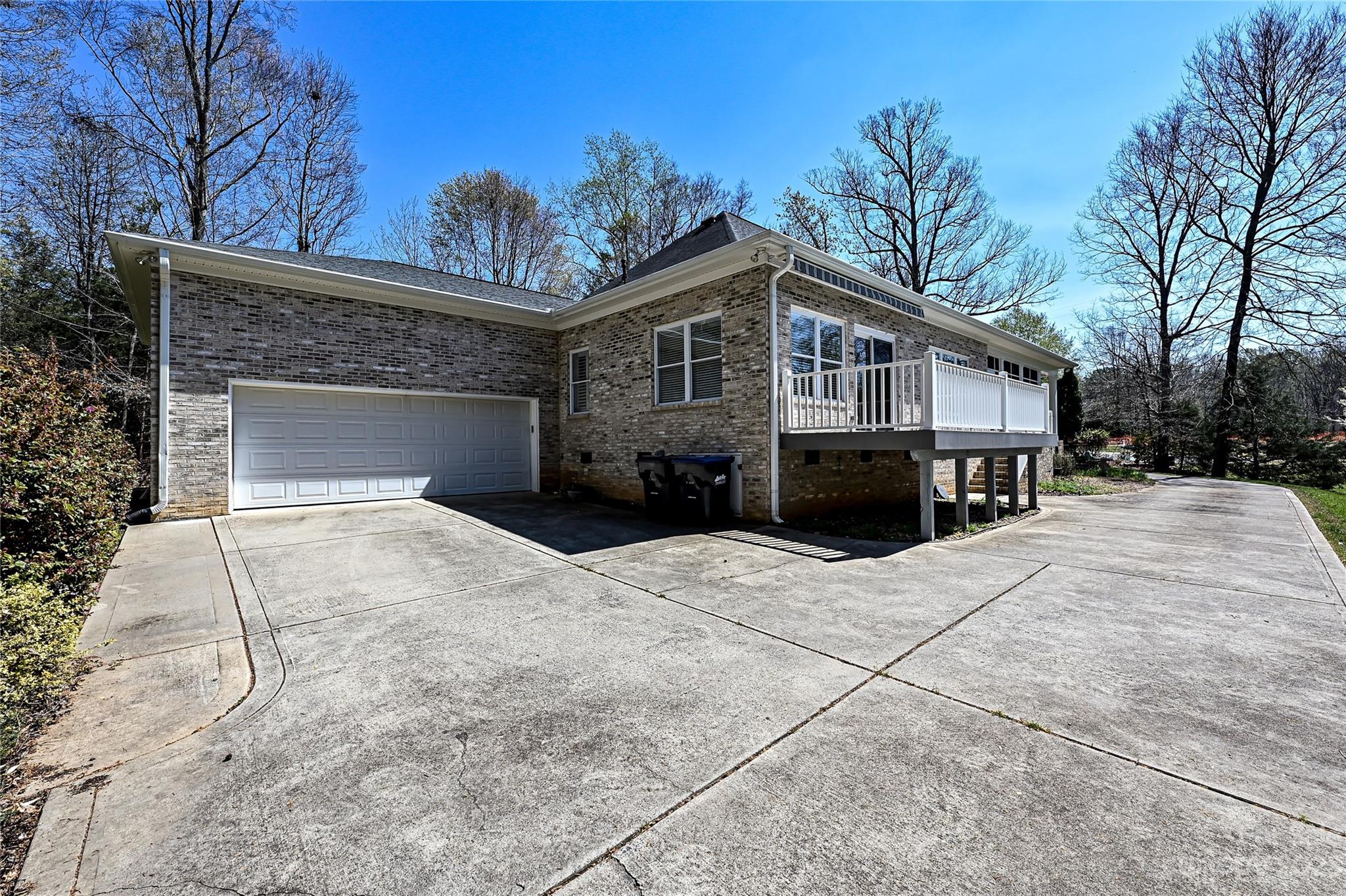 8834 Wingard Road Waxhaw, NC 28173 - Photo 44 of 46 a front view of a house with a yard and garage