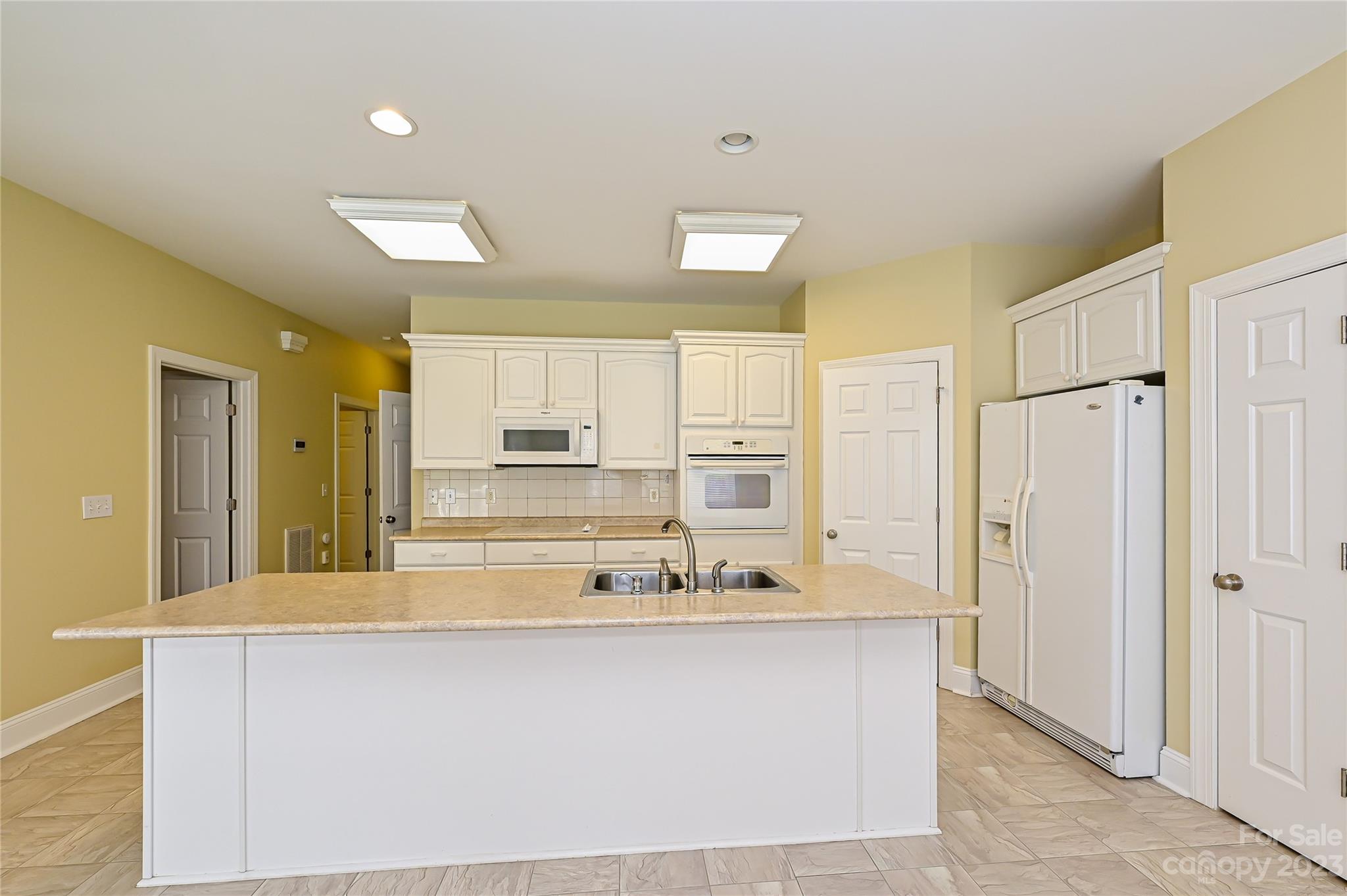 8834 Wingard Road Waxhaw, NC 28173 - Photo 8 of 46 a bathroom with a sink mirror and a bath tub