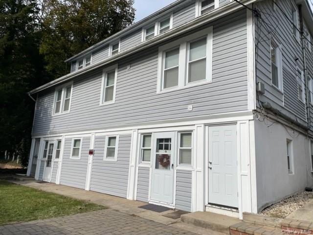 175 Main Street, Unit G3 Northport, NY 11768 - Photo 1 of 1 a front view of a house with a yard