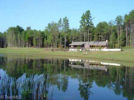 Exterior Front. Log cabin clubhouse w/ pavilion