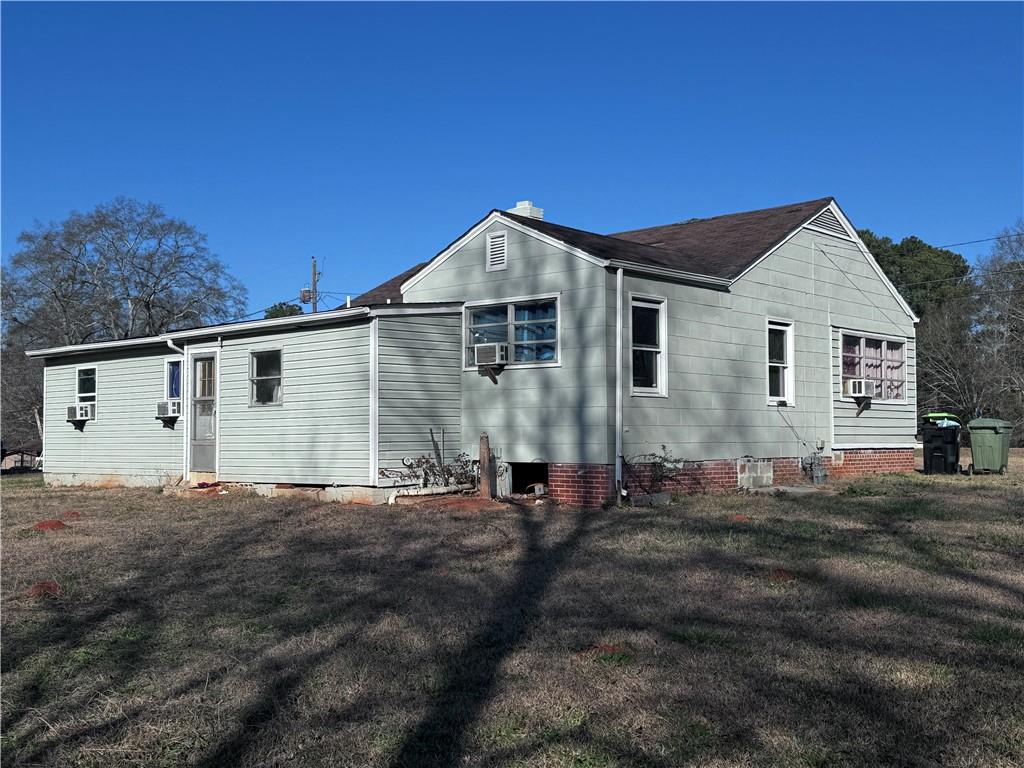 209 Denham Street Thomaston, GA 30286 - Photo 3 of 13 a view of a house with a yard
