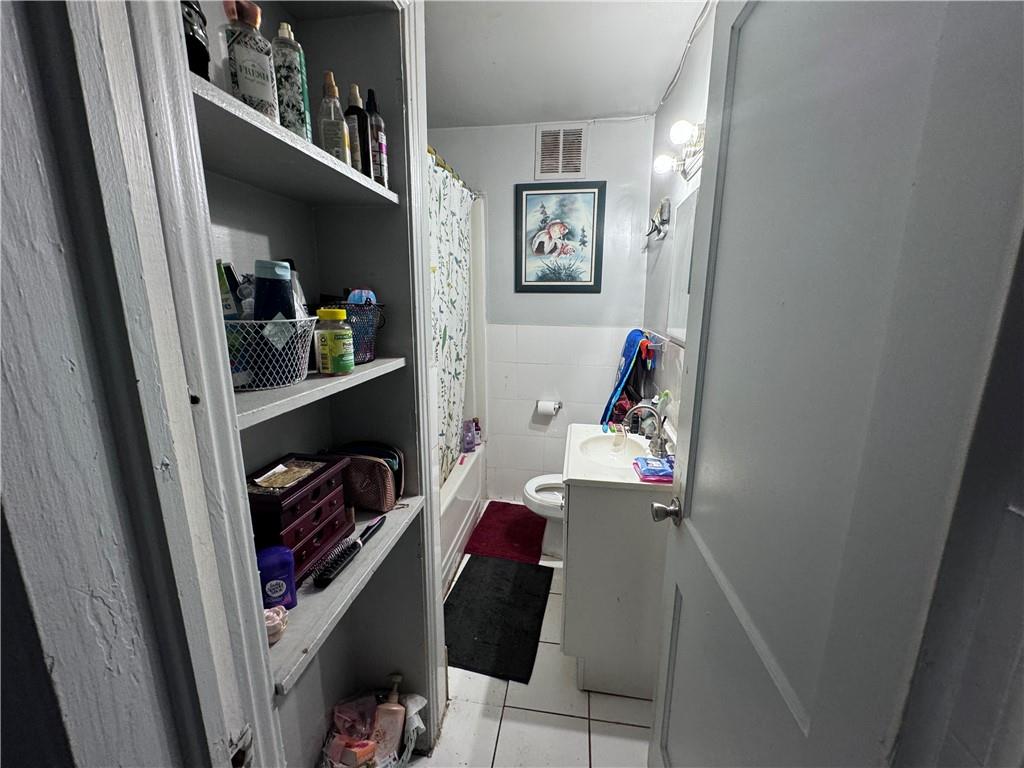 209 Denham Street Thomaston, GA 30286 - Photo 4 of 13 a view of walk in closet with clothes and shoes