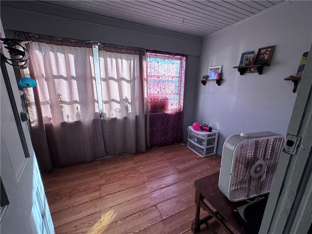 209 Denham Street Thomaston, GA 30286 - Photo 5 of 13 a bedroom with furniture and a window