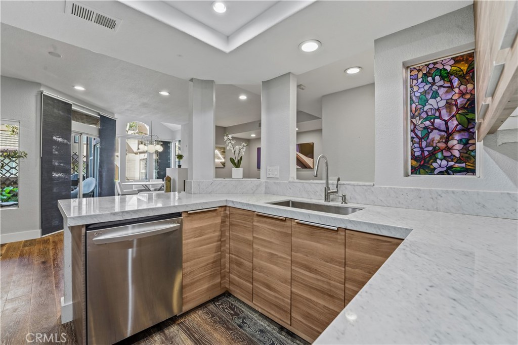 5 Baycrest Place Dana Point, CA 92629 - Photo 11 of 23 a kitchen with white cabinets a sink and dishwasher