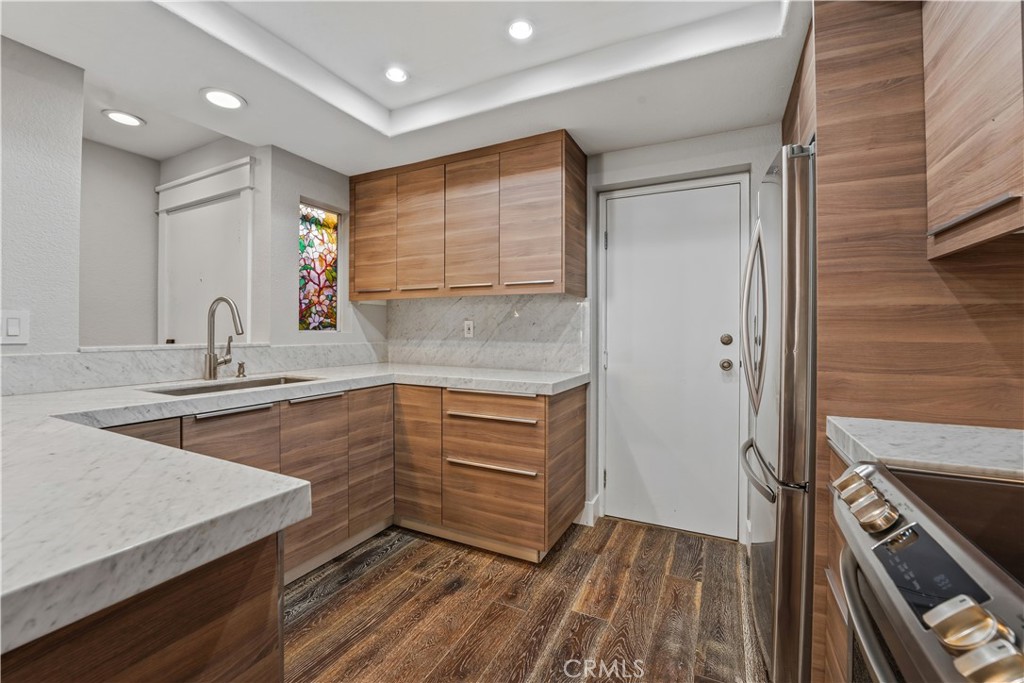 5 Baycrest Place Dana Point, CA 92629 - Photo 10 of 23 a kitchen with granite countertop a sink and a stove