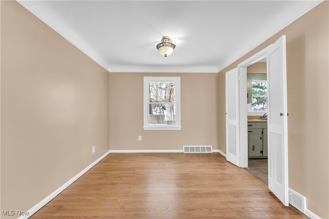 4693 Liberty Road South Euclid, OH 44121 - Photo 9 of 33 Unfurnished dining area featuring light wood-type flooring and baseboards