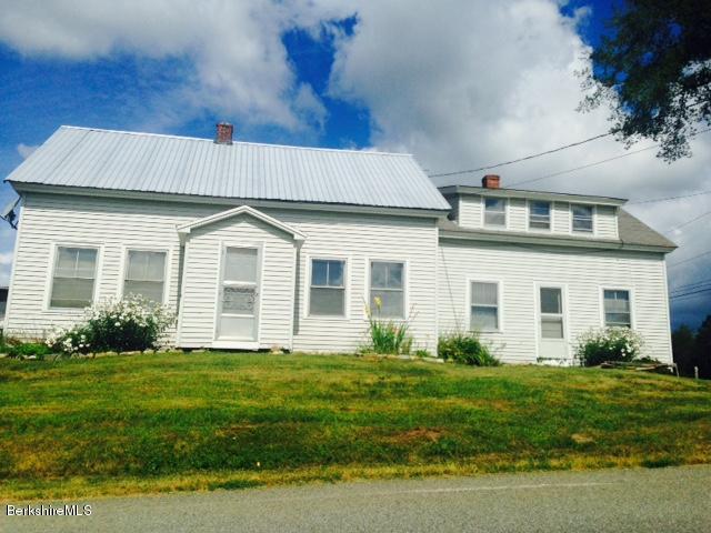 625 Middle Road Clarksburg, MA 01247 - Photo 2 of 6 a front view of a house with a yard