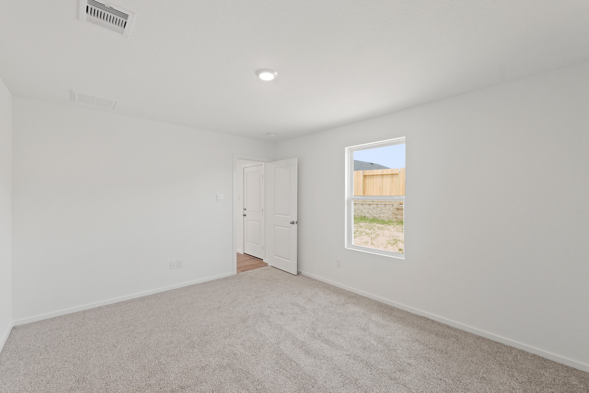 22710 Ravine Edge Court Hockley, TX 77447 - Photo 15 of 23 a view of an empty room and window