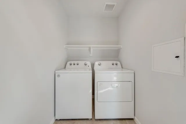 a utility room with dryer and washer