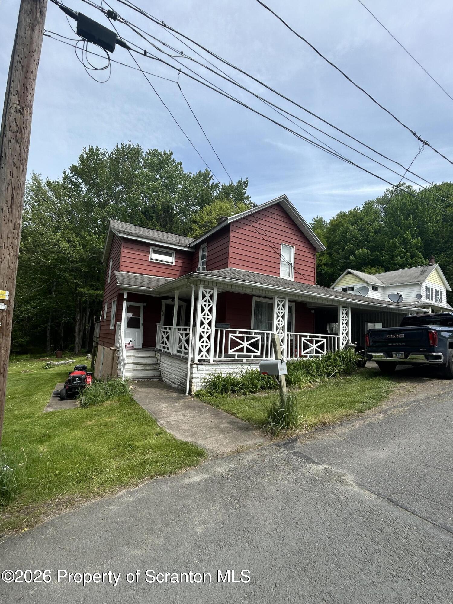 63 Shannon Street Simpson, PA 18407 - Photo 2 of 18 a view of a house with a yard and sitting area