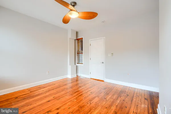 a view of room with wooden floor