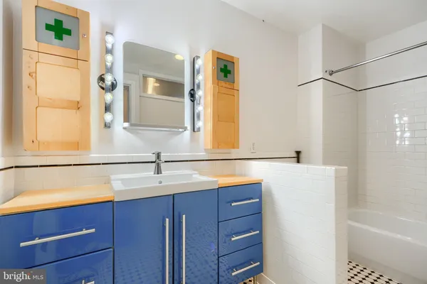 a bathroom with a sink and a bathtub
