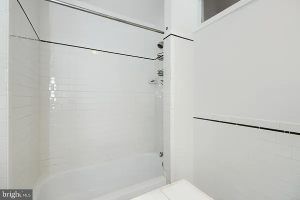 a bathroom with a shower and a shower