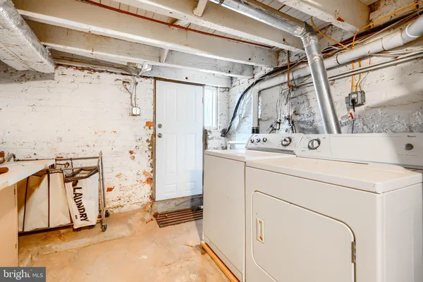 a utility room with a washer and dryer