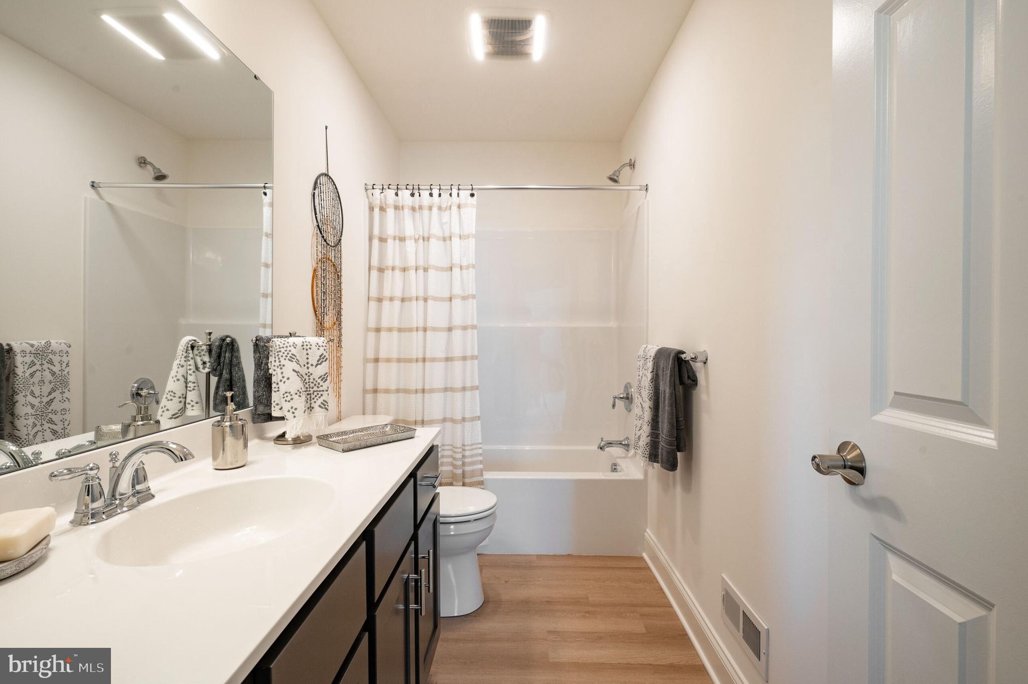 0 Old Orch Road, Unit LAUREL Strasburg, PA 17579 - Photo 14 of 15 a bathroom with a sink a toilet and shower
