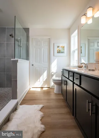 a room with a table chairs and a window