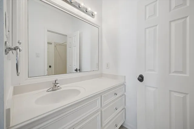 a bathroom with a sink and mirror