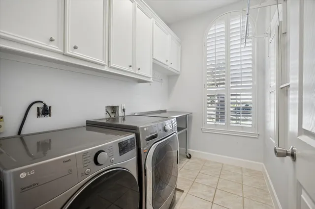a utility room with closet dryer and washer
