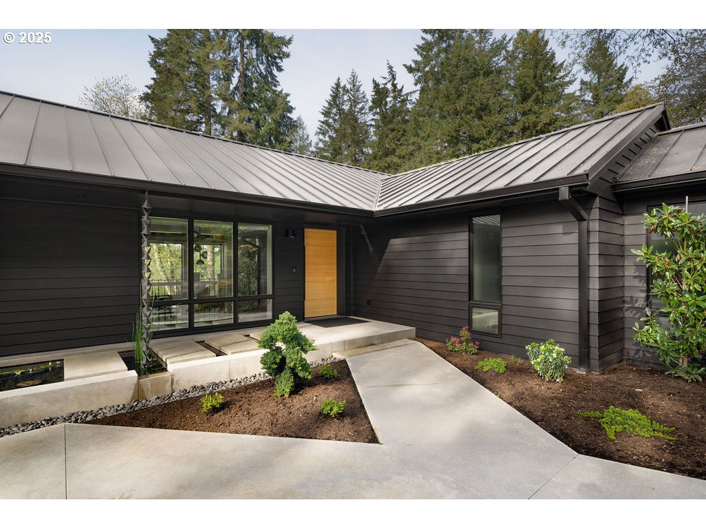 2627 Park Road Lake Oswego, OR 97034 - Photo 2 of 47 a front view of a house with a yard outdoor seating and garage
