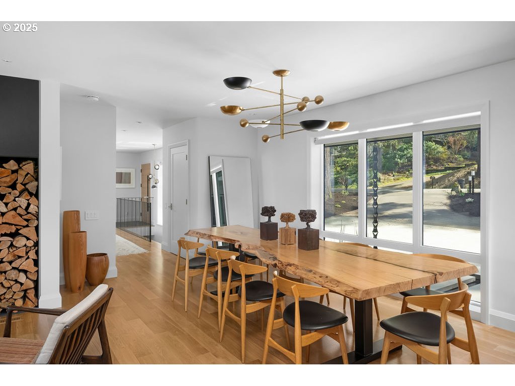 2627 Park Road Lake Oswego, OR 97034 - Photo 5 of 47 a dining room with furniture a chandelier and wooden floor