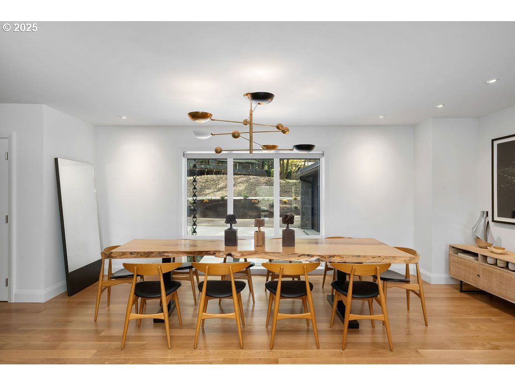 2627 Park Road Lake Oswego, OR 97034 - Photo 6 of 47 a view of a dining room with furniture and wooden floor