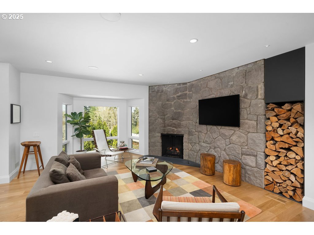2627 Park Road Lake Oswego, OR 97034 - Photo 7 of 47 a living room with furniture a flat screen tv and a fireplace