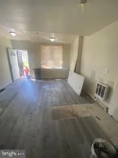 a view of an empty room and a window