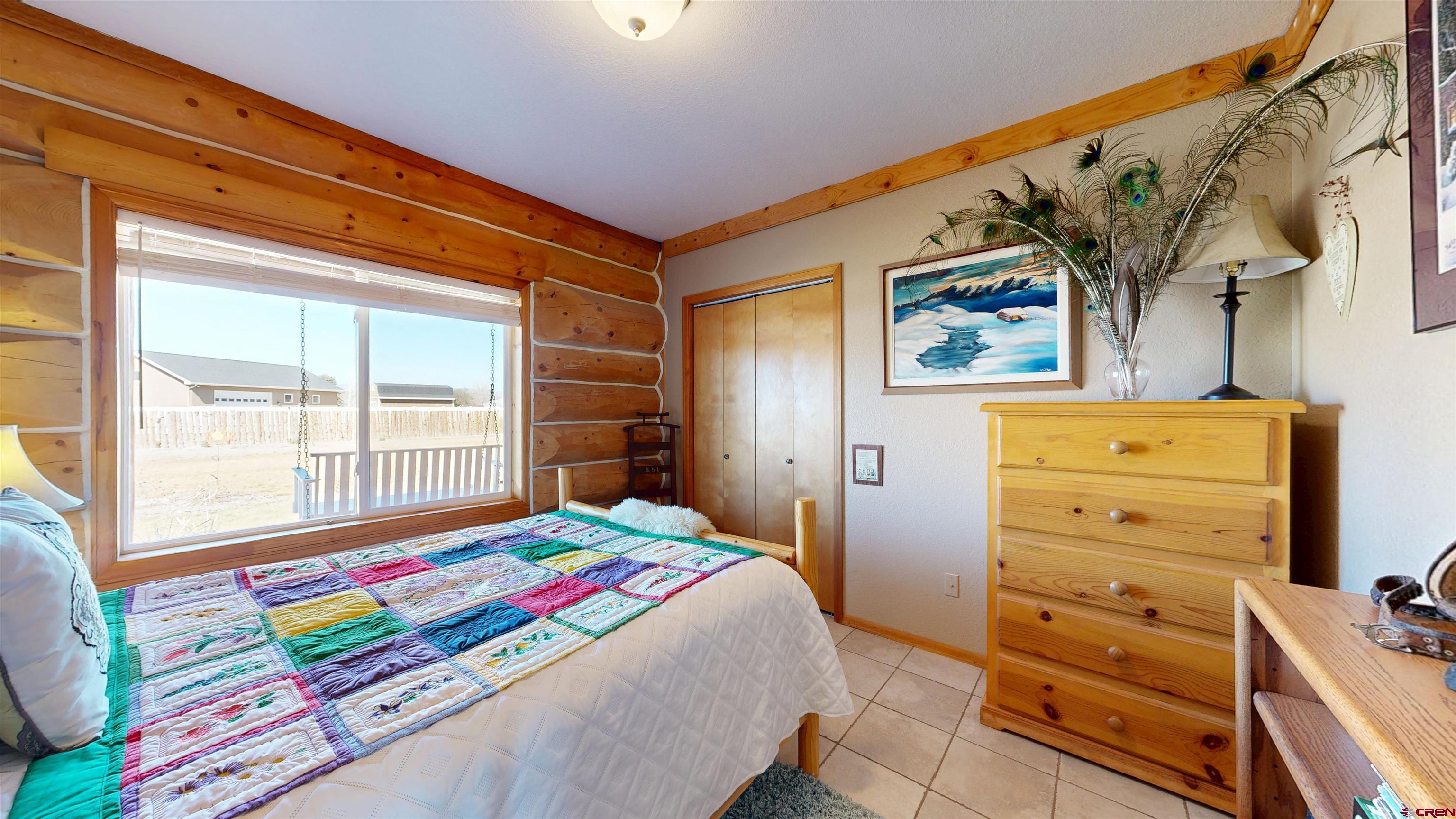 2083 Pioneer Road Delta, CO 81416 - Photo 15 of 43 a bedroom with a bed and a window