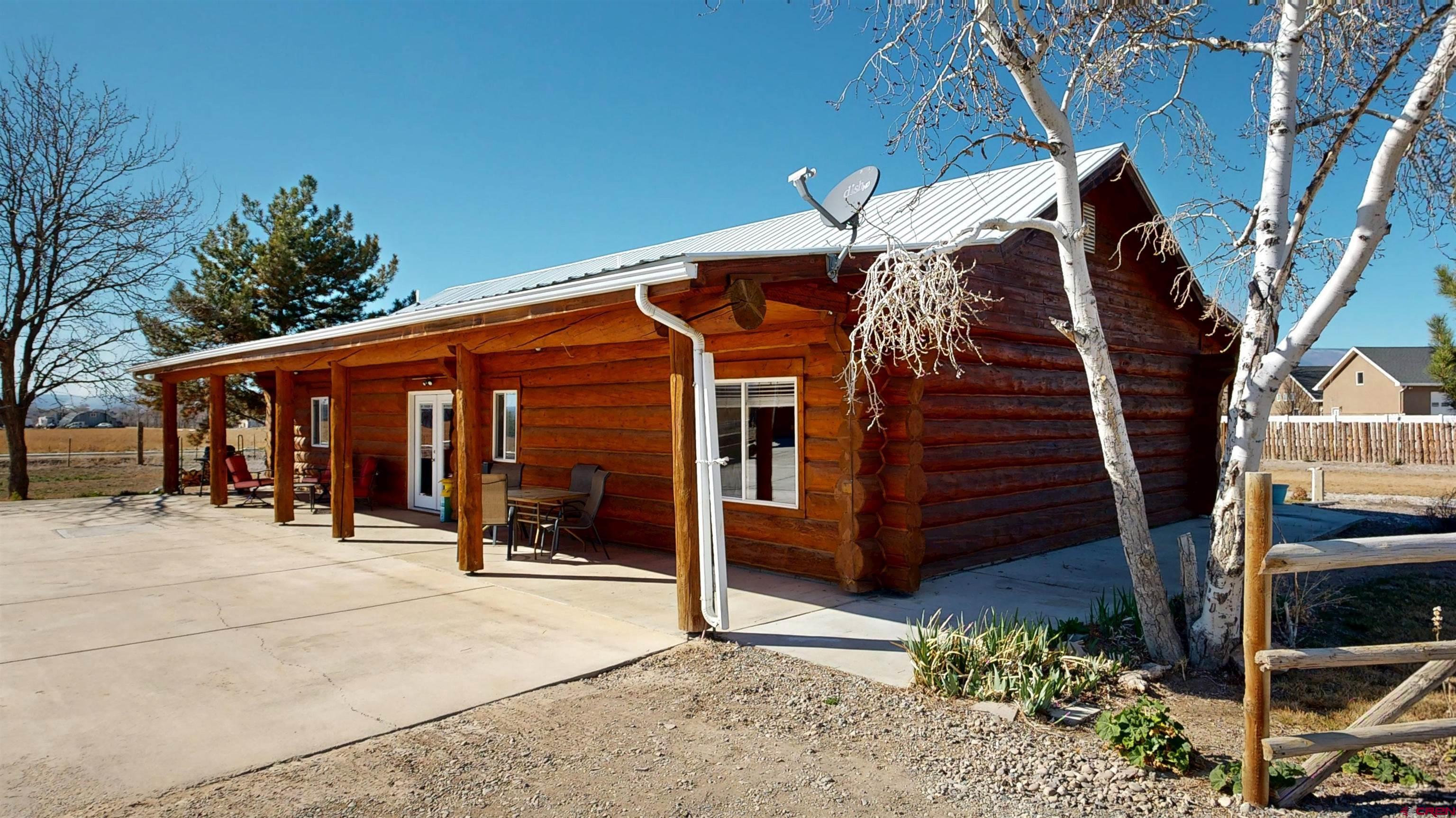 2083 Pioneer Road Delta, CO 81416 - Photo 2 of 43 a view of a house with wooden fence